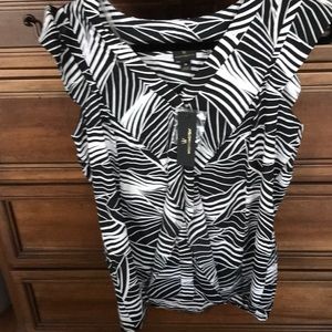 Very pretty multi colored black and white ruffle  short sleeve shirt .